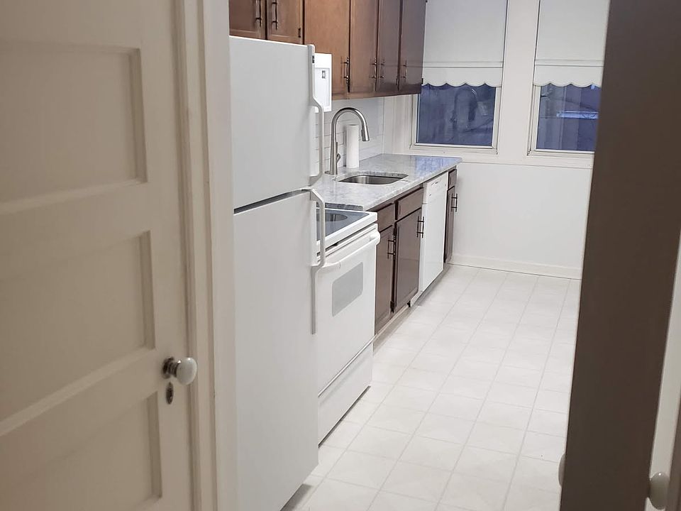 Kitchen from the hallway. Washer and dryer behind the door next to the refrigerator.
