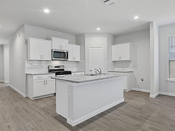 Kitchen - All Home and community information, including pricing, included features, terms, availability and amenities, are subject to change at any time without notice or obligation. All Drawings, pictures, photographs, video, square footages, floor plans, elevations, features, colors and sizes are approximate for illustration purposes only and will vary from the homes as built.