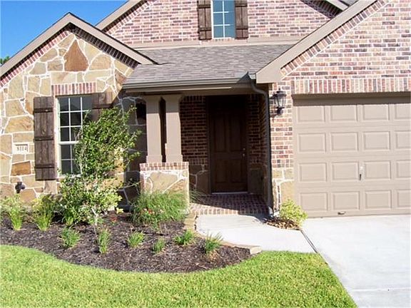 Corner lot, cul-de-sac street, covered front porch, stone and brick beautiful elevation