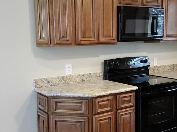Custom Angled Kitchen Cabinets with Granite Countertops