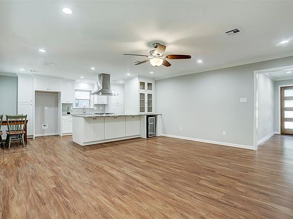 Open concept with a large living room showing entrance with new front door.