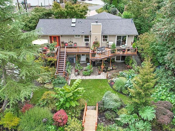 Rear of home. Entertainment size deck spans the entire rear of the house. >