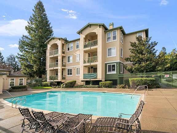 Pool with spa, and fitness room.