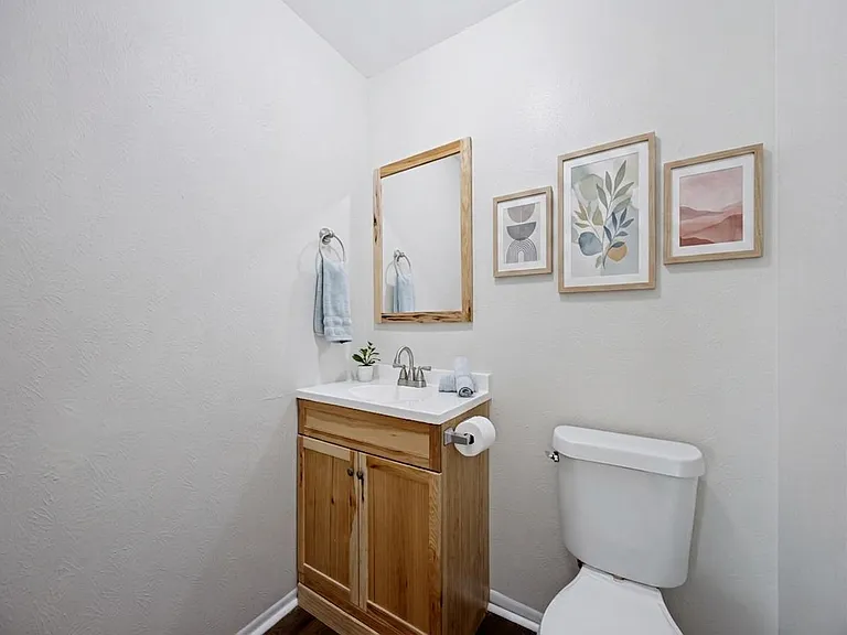 Primary suite half bath.