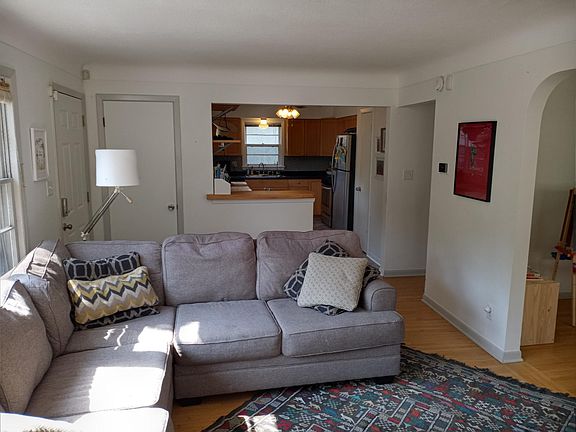 Main living room looking toward open kitchen and dinning area and flex space to the right