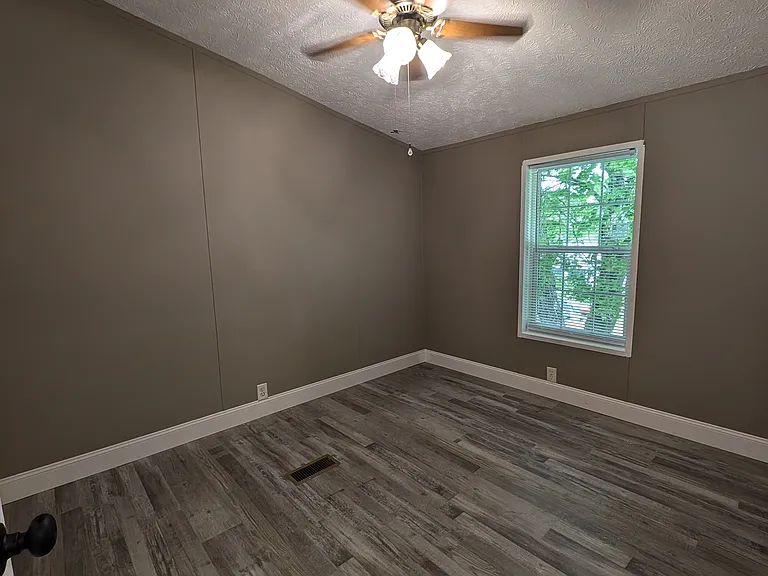Bedroom 2 with closet and window