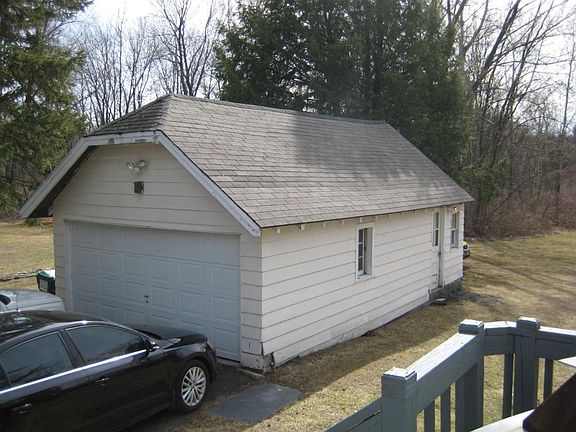 over sized two car garage with rear storage