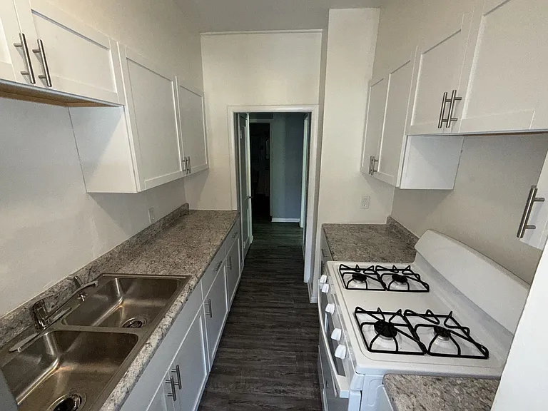 Newly remodeled kitchen! New cabinets and countertops with a gas range!