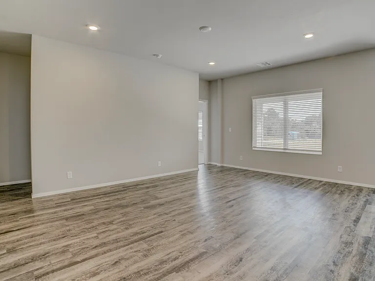 View from near the pantry. Directly ahead is the master bedroom and to the left is the entrance to a full bathroom and bedroom #2.
