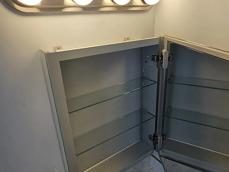 For big lights above. Mirror inside the medicine cabinet door.