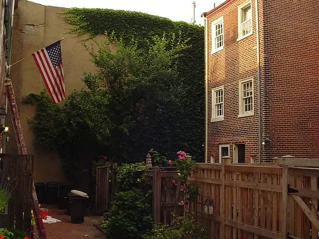 View of gated shared courtyard, from stoop