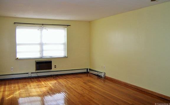 Living Room with Gleaming H...