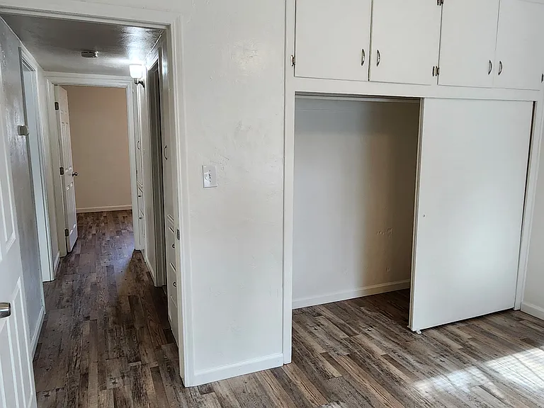 Front Bedroom closet and view to hallway