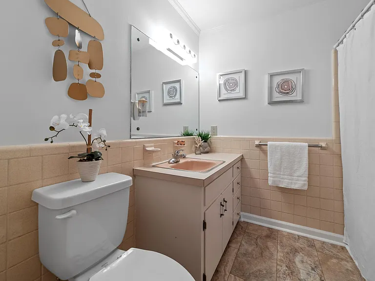 Second bathroom, with tub and shower.