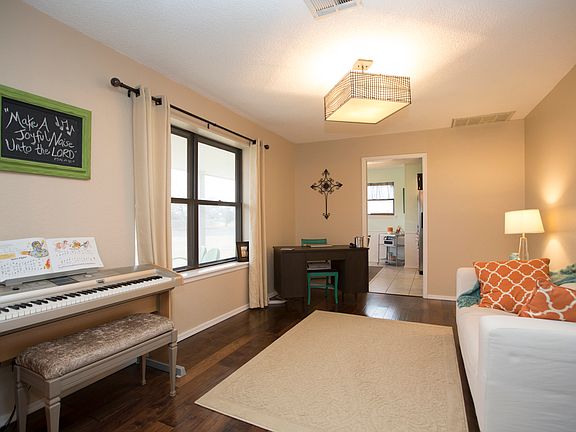 Notice the beautiful wooden flooring, modern lighting and contemporary paint.  You will love this home!