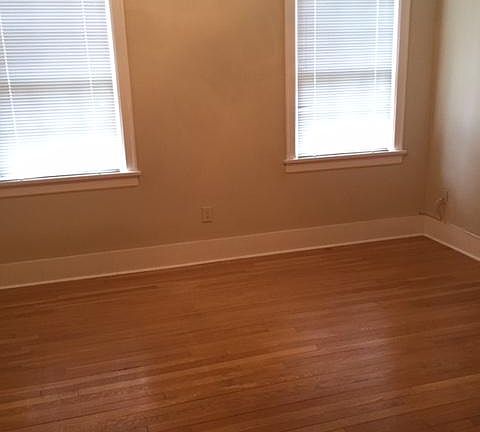 Large bedroom with beautiful hardwood floors, great closet space and nice natural sun light.