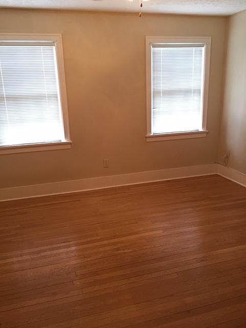 Large bedroom with beautiful hardwood floors, great closet space and nice natural sun light.