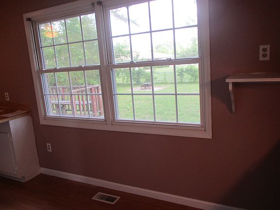 Kitchen window with view of back yard