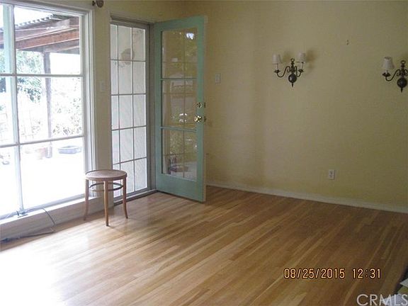 The living room hardwood flooring was refinished,  this room also has crown moulding