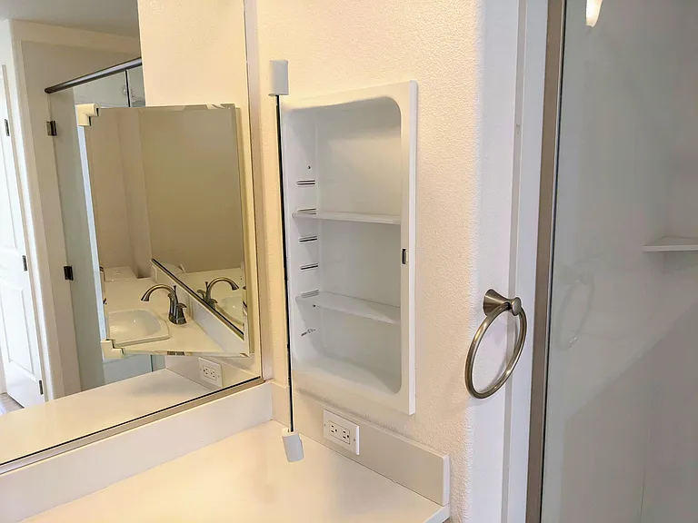 Medicine cabinets in both bathrooms