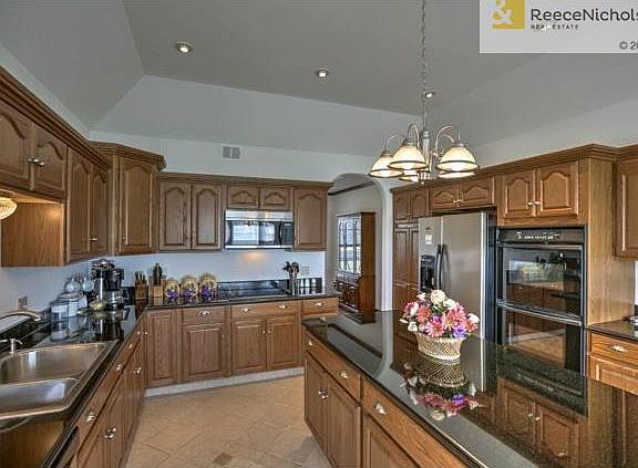 Lots of cabinets provide storage and flow in this beautiful kitc