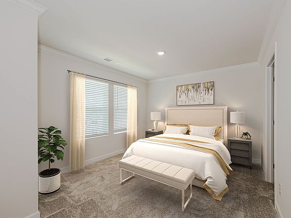 Relax and unwind in the secluded primary suite after a long day.