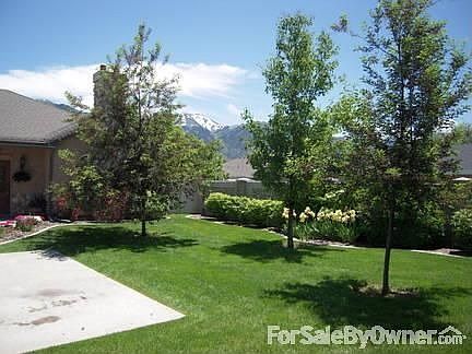 Views of mountains from entry : Landscaping maintained by HOA. Spinkler system keeps everything beau