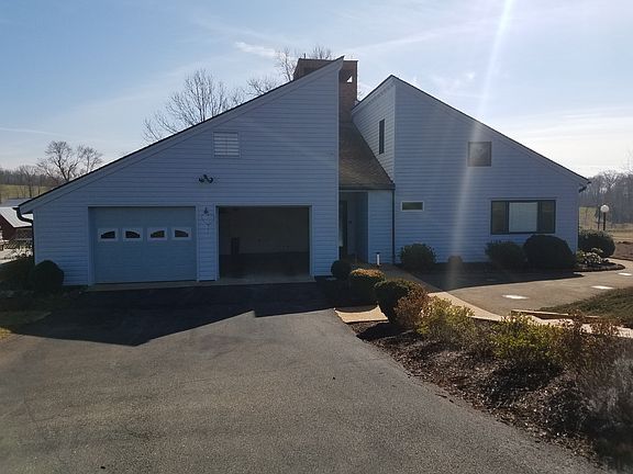 2-Car Garage & Paved Driveway