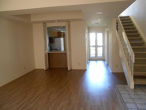 Interior living room, staircase to 2 bedrooms, 2 baths