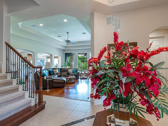 The tiled foyer welcomes you into the home and escorts you past the study towards the open family room and kitchen area.