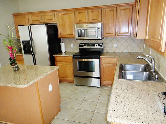Huge kitchen with tons of cabinet and counter space. Silesto