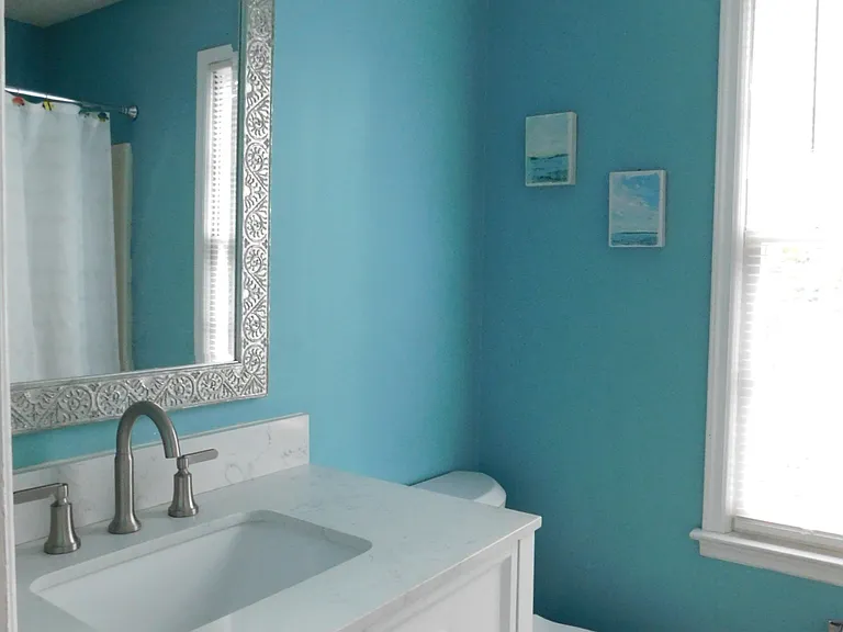 Vanity with stone countertop in the second full bath.