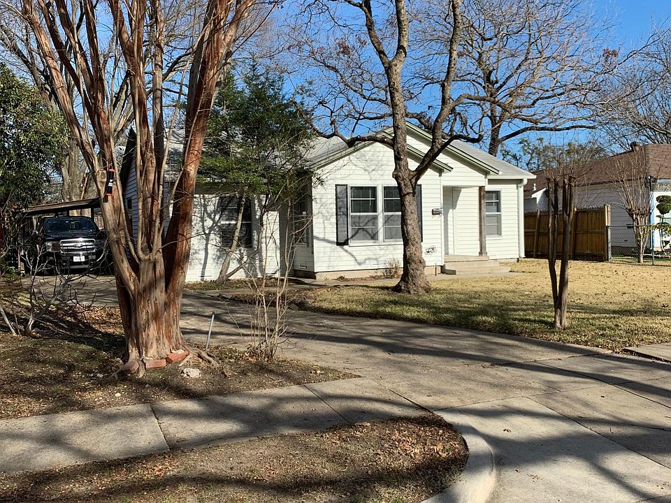 carport and side door on left side of house