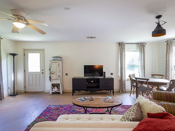 front entry on left. All concrete flooring, no carpet.