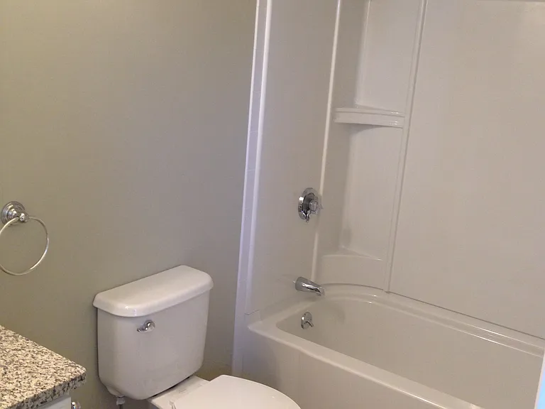 Master suite bathroom. Tile floor with granite countertop.