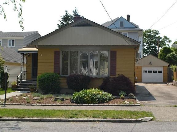 Exterior front showing detached garage