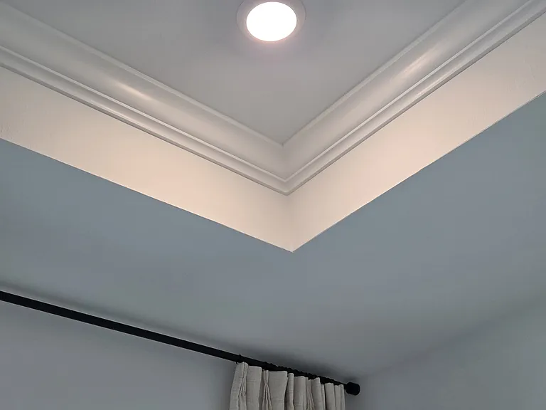 Crown molding in tray ceiling.