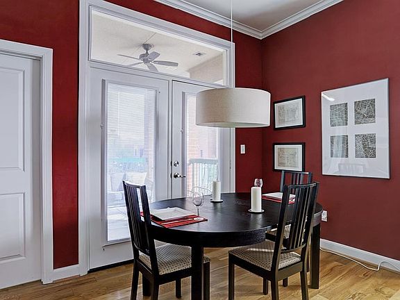 The dining area has access to the private balcony