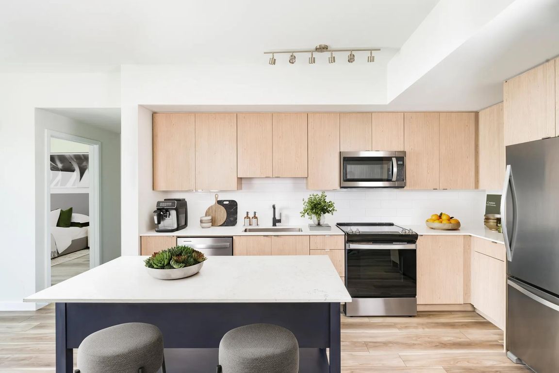 Contemporary kitchens at Modera Aventura showcase clean lines, warm finishes, and thoughtful design.