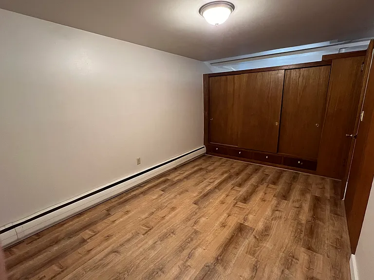 bedroom , wall to wall closet with drawers below , also in bedroom linen closet just outside of bathroom door , lots of storage !