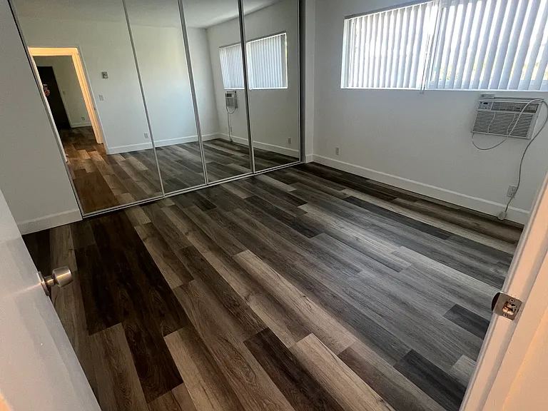 2nd bedroom with large 13 foot sliding mirror closet doors