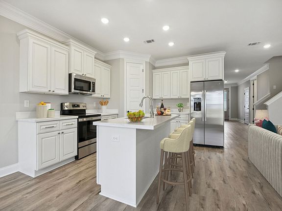 Kitchen in the Dune floorplan at a Meritage Homes community in Gulfport, MS.