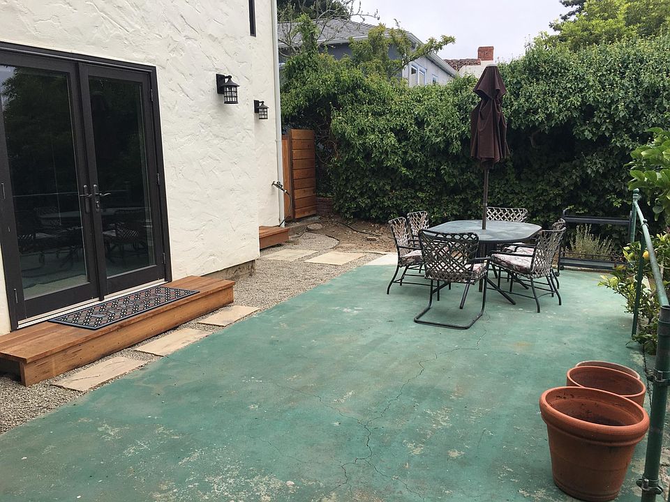 Secluded backyard with outdoor eating and lemon tree at your disposal. French doors open to living room.