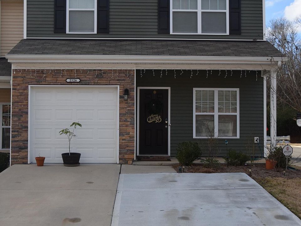 Front Elevation with 1 car garage and 2 drive pads