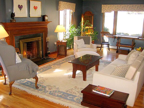 Living Room - Light pours in through the large bay window. 
