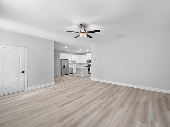 The family room is spacious and has easy access to the kitchen