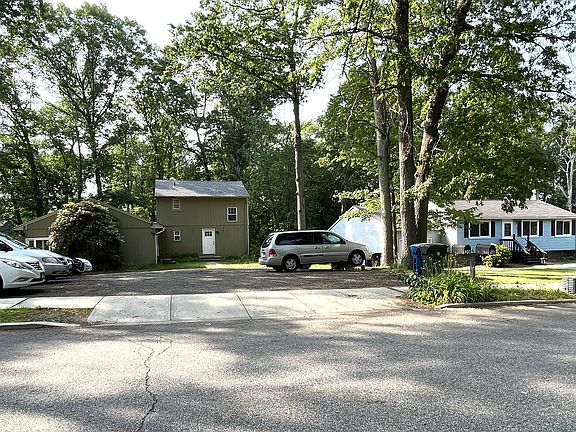 Home from the street. 4 designated parking spots for colonial home on Right side of driveway.