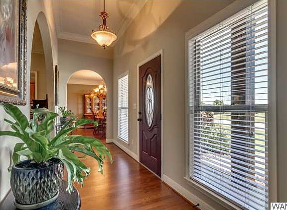 Beautiful lighting details, hardwood floors and arches!