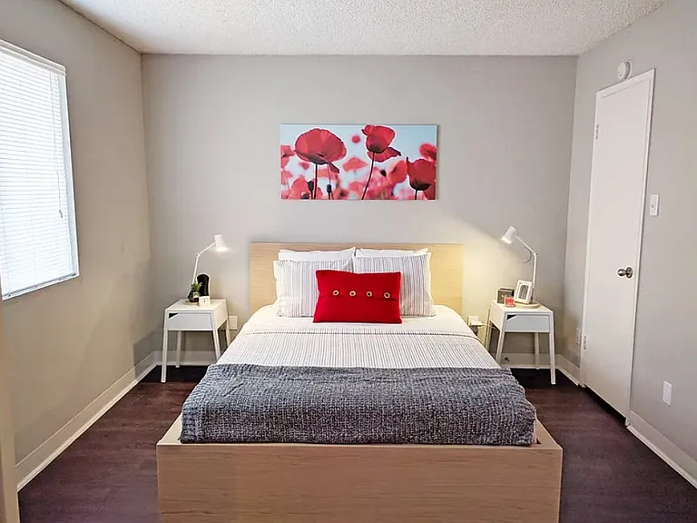 Bedroom with neutral tones and accent wall decor