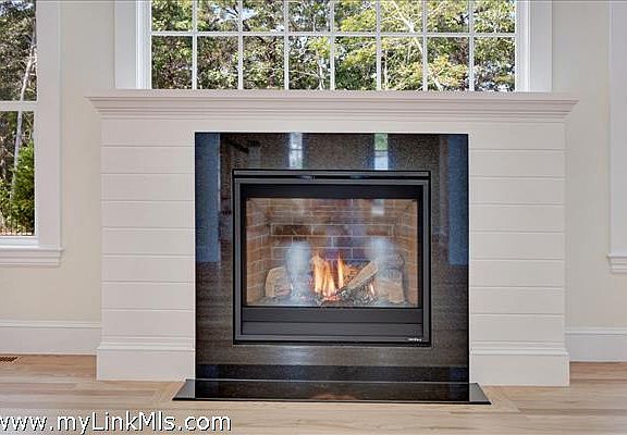 sample of gas fireplace with shiplap surround
